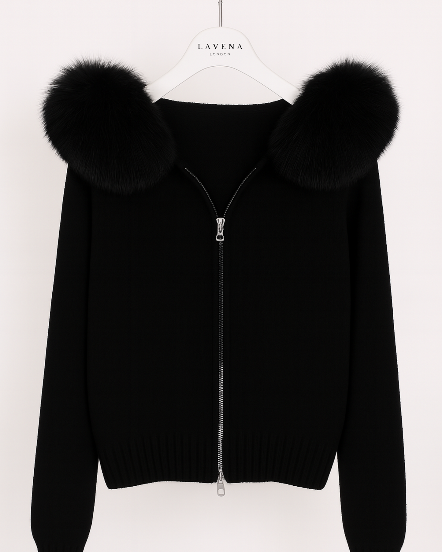 Black zip-up hoodie with fur collar on a white background